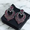 Oxidized silver replica dangler earrings with peacock design and stone work.