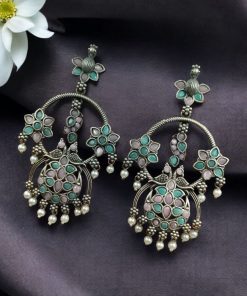 Ethnic peacock earrings with oxidized silver replica finish, stone and pearl work.