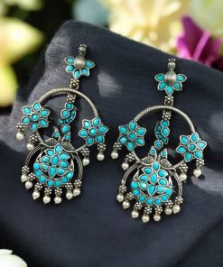 Ethnic peacock earrings with oxidized silver replica finish, stone and pearl work.