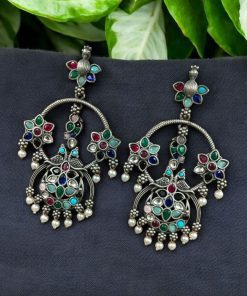 Ethnic peacock earrings with oxidized silver replica finish, stone and pearl work.