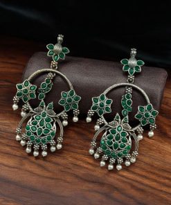 Ethnic peacock earrings with oxidized silver replica finish, stone and pearl work.