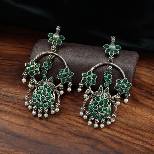 Ethnic peacock earrings with oxidized silver replica finish, stone and pearl work.