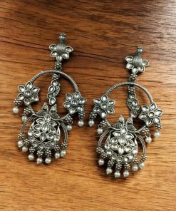 Ethnic peacock earrings with oxidized silver replica finish, stone and pearl work.
