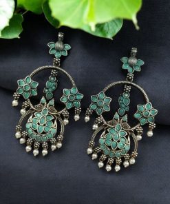 Ethnic peacock earrings with oxidized silver replica finish, stone and pearl work.