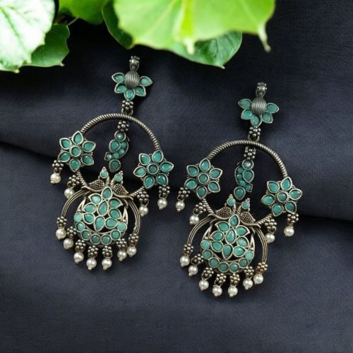 Ethnic peacock earrings with oxidized silver replica finish, stone and pearl work.