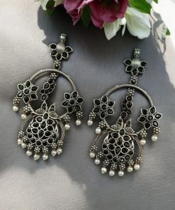 Ethnic peacock earrings with oxidized silver replica finish, stone and pearl work.