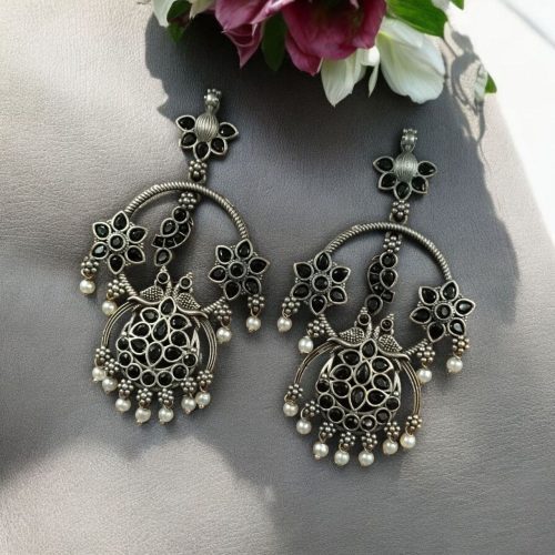 Ethnic peacock earrings with oxidized silver replica finish, stone and pearl work.