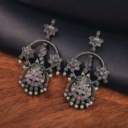 Ethnic peacock earrings with oxidized silver replica finish, stone and pearl work.
