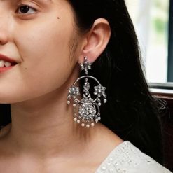 Ethnic peacock earrings with oxidized silver replica finish, stone and pearl work.