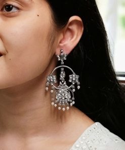 Ethnic peacock earrings with oxidized silver replica finish, stone and pearl work.