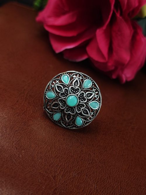 Oxidized silver heart ring with stone accent.