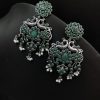 Handcrafted silver-plated peacock earrings with pearl and stone embellishments.