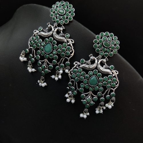 Handcrafted silver-plated peacock earrings with pearl and stone embellishments.