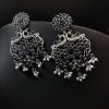 Handcrafted silver-plated peacock earrings with pearl and stone embellishments.