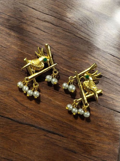 Handcrafted gold-plated bird earrings with pearl detailing.