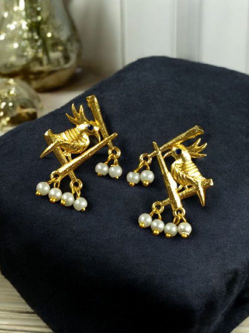 Handcrafted gold-plated bird earrings with pearl detailing.