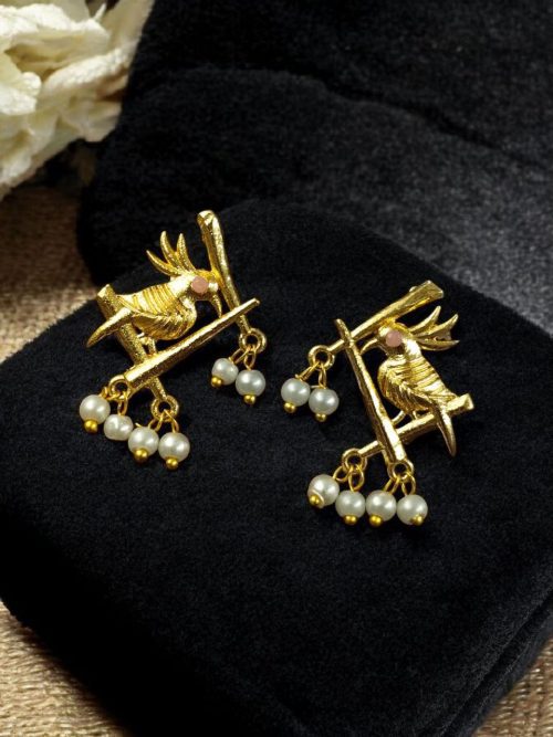 Handcrafted gold-plated bird earrings with pearl detailing.