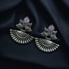 Handcrafted oxidized silver-plated peacock dangler earrings with stone detailing and pearl accents.