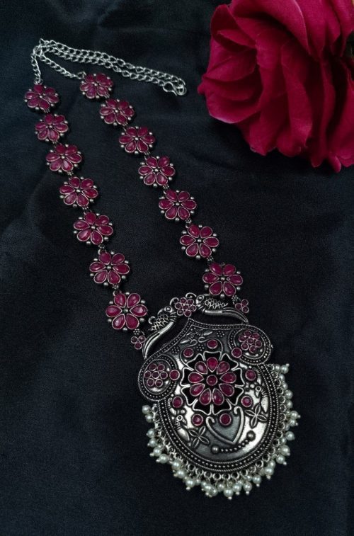 Silver-plated peacock necklace with pearls and stones.