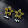 Ethnic flower stud earrings with pearl and stone detailing