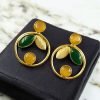 Gold plated leaf and circle earrings with Monalisa stone