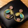 Gold plated leaf and circle design earrings with Monalisa stone