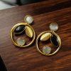 Gold plated leaf and circle earrings with Monalisa stone