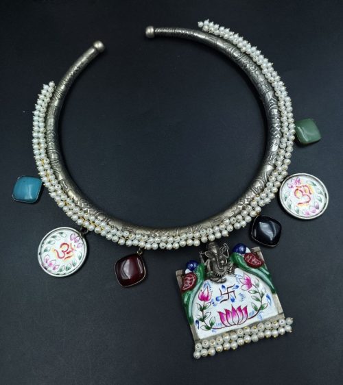 Oxidized Ganesha Hasli necklace with parrot design, Monalisa stones, and pearl work.