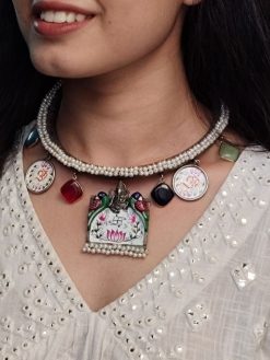 Oxidized Ganesha Hasli necklace with parrot design, Monalisa stones, and pearl work.