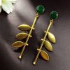 Gold plated leaf earrings with Monalisa stone in western style