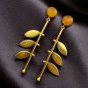 Gold plated leaf earrings with Monalisa stone in western style