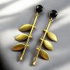 Gold plated leaf earrings with Monalisa stone in western style