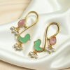 Gold plated enamel bird earrings with stone and pearl design