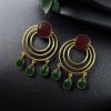 Gold plated round dangler earrings with Monalisa stone in ethnic western design