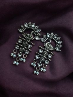 Brass peacock earrings with intricate design, lightweight and elegant