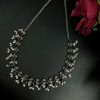 Antique-style silver plated brass neckpiece with intricate stone embellishments and traditional detailing, ideal for festive and ethnic wear.