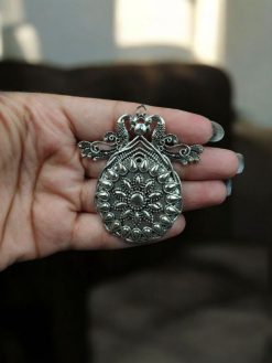 DIY peacock pendant made from premium German silver, featuring intricate detailing and elegant handcrafted design.