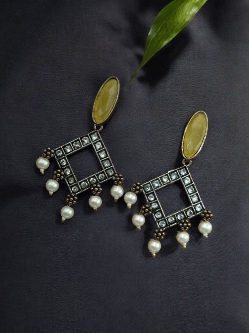 Brass hanging earrings with sparkling stones, featuring a stud base and elegant handcrafted design for special occasions