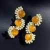 Gold-plated brass earrings featuring Monalisa stone in a contemporary design, perfect for festive and elegant occasions