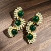Gold-plated brass earrings featuring Monalisa stone in a contemporary design, perfect for festive and elegant occasions
