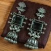 Brass jhumka stud earrings with beautiful stone detailing, lightweight and perfect for ethnic and festive occasions.