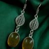 German silver hook hanging earrings with Monalisa stone, perfect for ethnic and casual occasions.