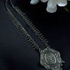 Ethnic statement necklace made of German silver and brass with elegant long design, perfect for festive or casual wear.