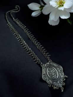 Ethnic statement necklace made of German silver and brass with elegant long design, perfect for festive or casual wear.