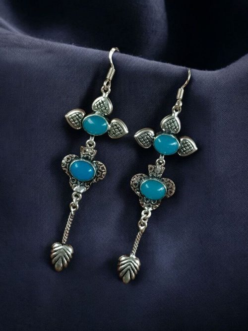 Beautiful German silver hook hanging earrings with vibrant stones, lightweight and perfect for enhancing traditional ethnic outfits.
