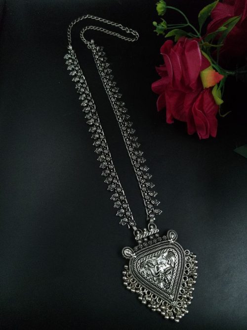 Bold and elegant long necklace made of brass and German silver, featuring traditional design elements.