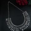 Beautiful silver-plated brass necklace with intricate ethnic design, perfect for traditional and festive wear.