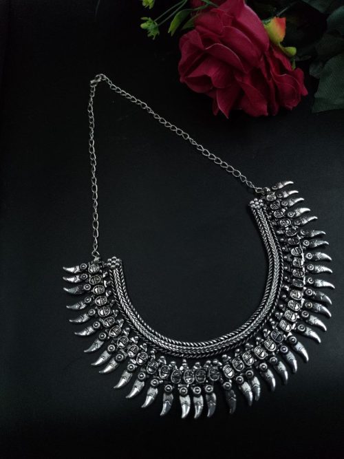 Beautiful silver-plated brass necklace with intricate ethnic design, perfect for traditional and festive wear.