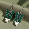 Pair of beautiful brass butterfly hook earrings with sparkling stone accents, ideal for daily wear
