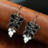 Pair of beautiful brass butterfly hook earrings with sparkling stone accents, ideal for daily wear